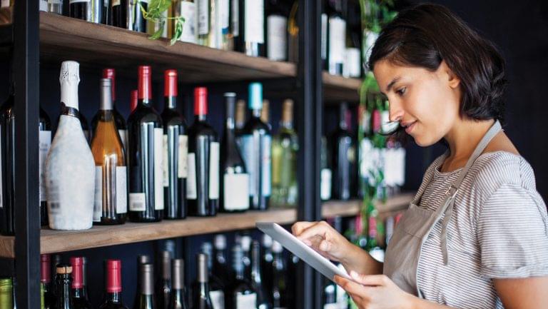 Woman checks her wine inventory