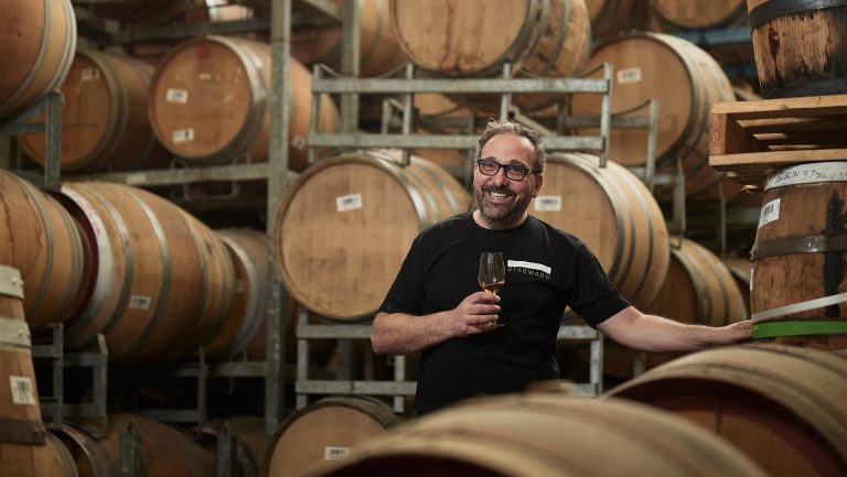 Dave Vitale surrounded by barrels