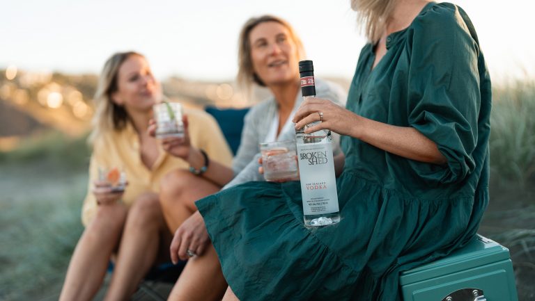Three women share a bottle of Broken Shed Vodka
