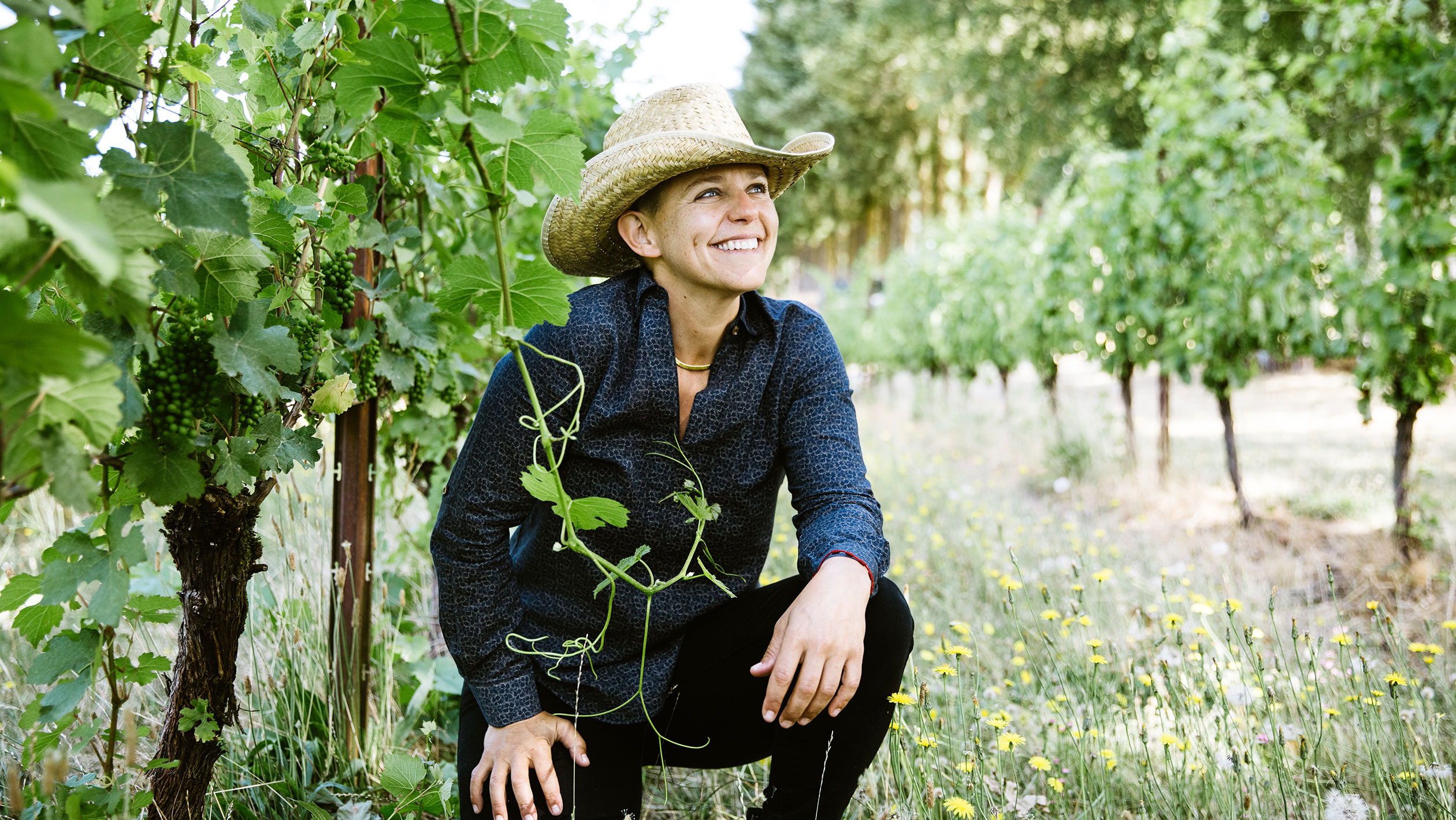 Remy Drabkin poses in her vineyard