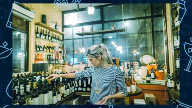 A woman browses aisles stocked with wine