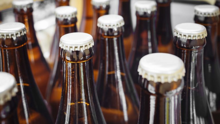 A closeup of glass beer bottles