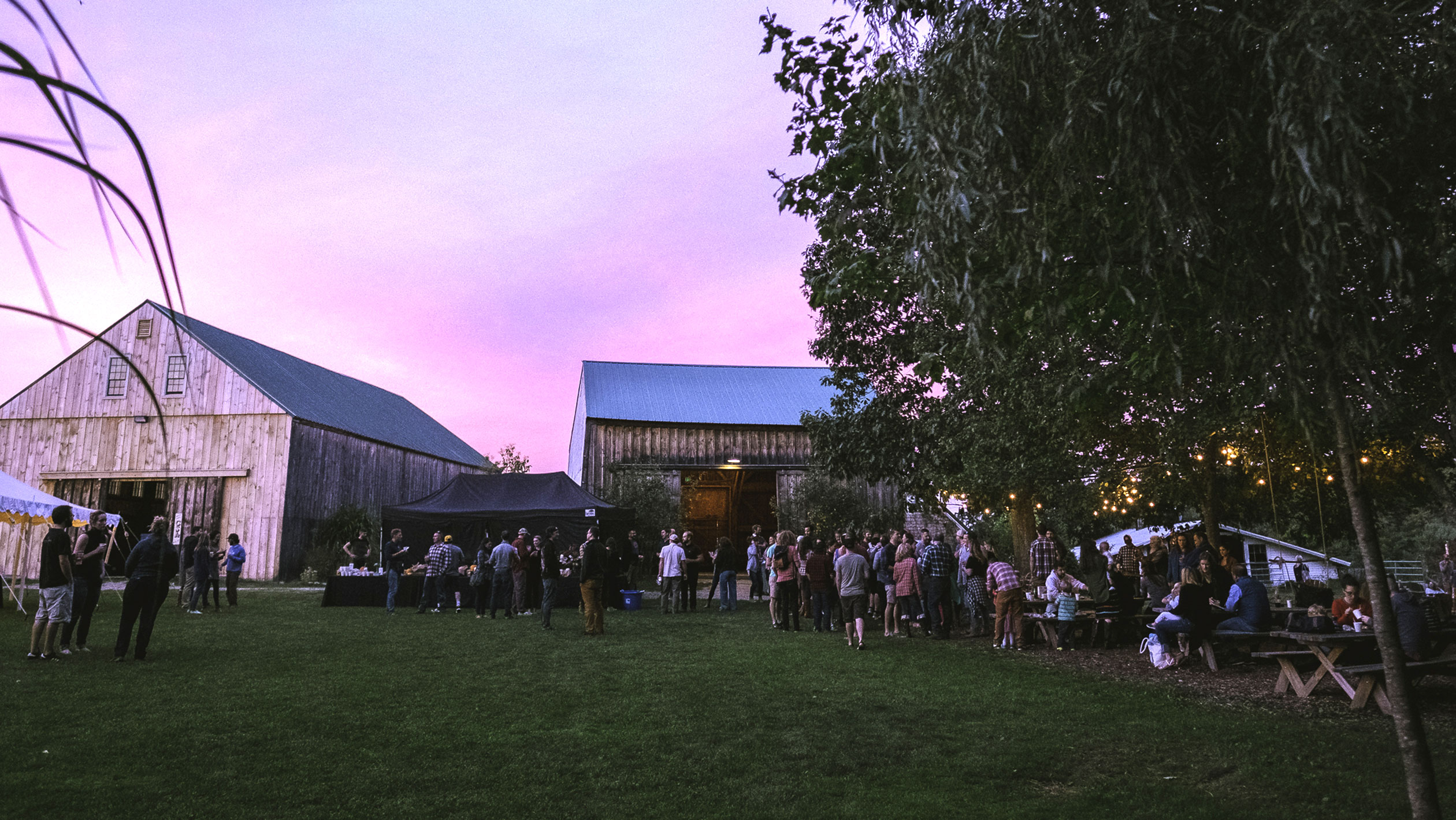 People gather outside of a brewery during an event organized by Allagash.