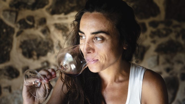 Arianna Occhipinti poses while smelling a sample of red wine