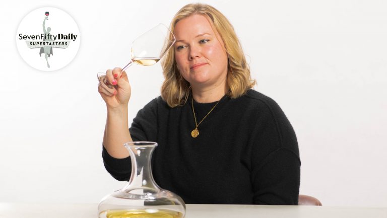 Amy Waller inspects a sample of white German wine