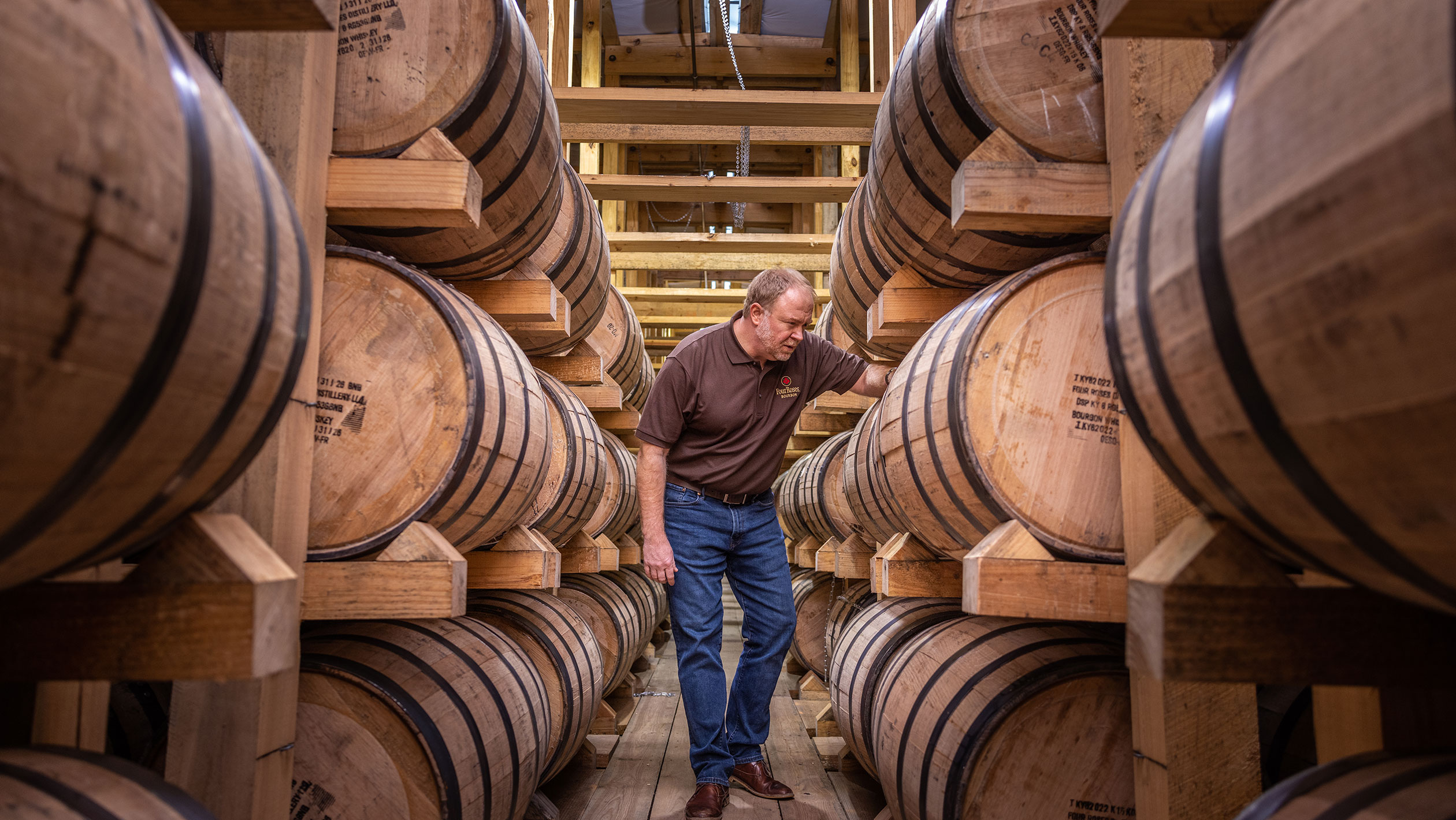 Brent Elliot inspects Four Roses barrels.