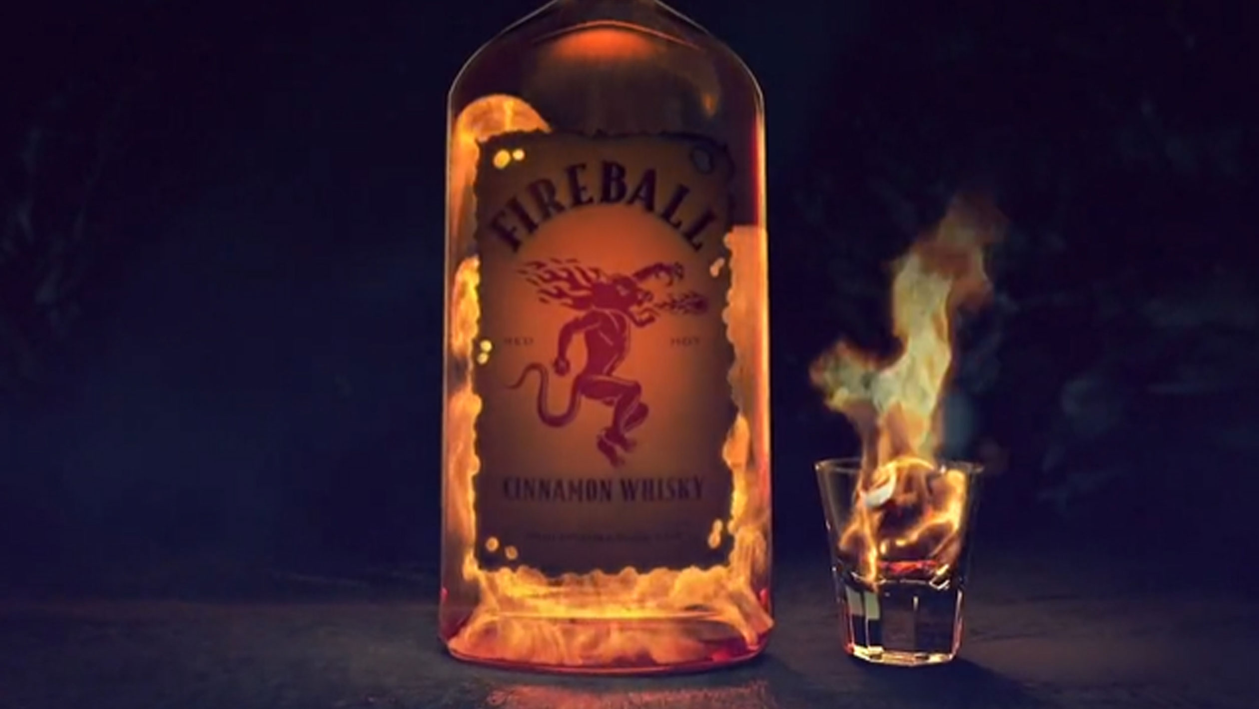 A bottle of Fireball against a dark background