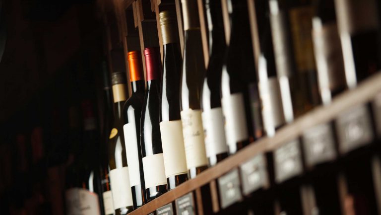 A close up of a rack of wine bottles