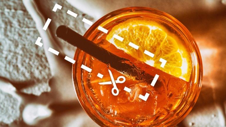 scissors cutting out a straw from a cocktail