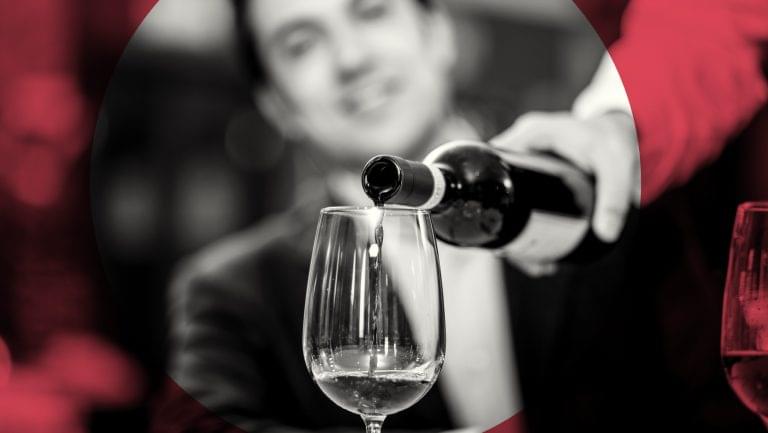 sommelier pouring wine