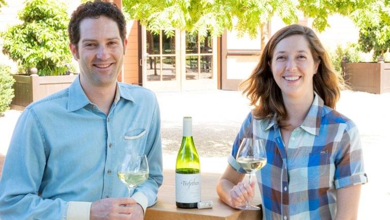 Lorenzo and Hailey Trefethen enjoy a bottle of their chardonnay