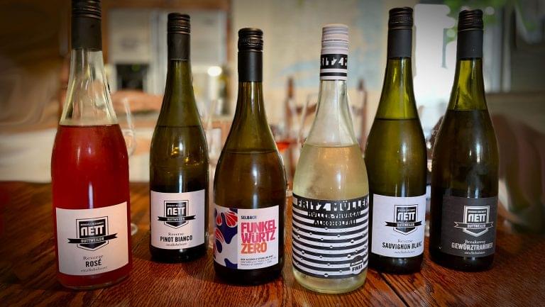 A collection of nonalcoholic German wine bottles