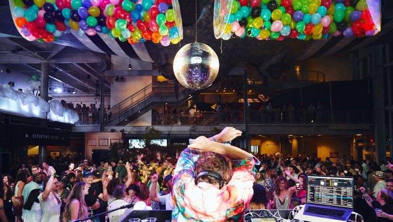 A party at Tales of the Cocktail photographed from behind a DJ