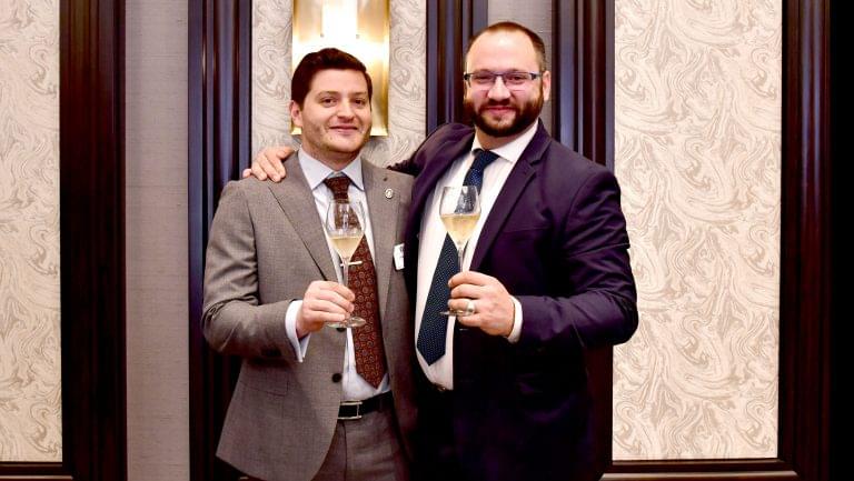 Jonathan Eichholz, MS and Mark Guillaudeu, MS pose with glasses of wine