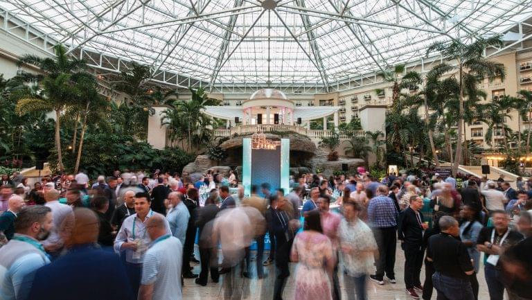 Wide shot of professionals milling through the 2023 WSWA Access LIVE conference