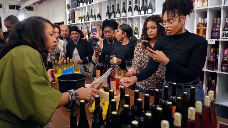 Jonell Boyd pours a glass of Boyd Cru for Isis Daniel, the Millennial Somm, at the new Urban Grape location in Washington DC.