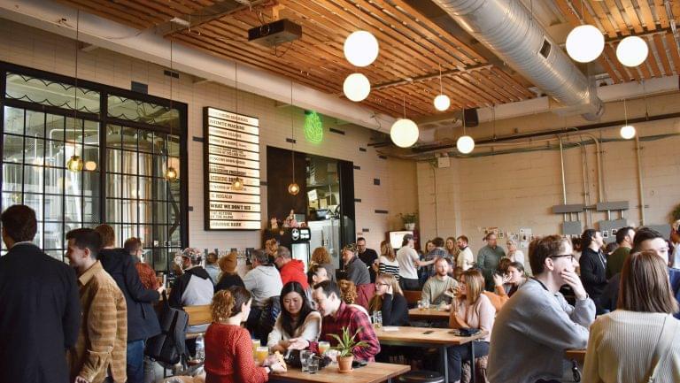 A KCBC taproom filled with customers