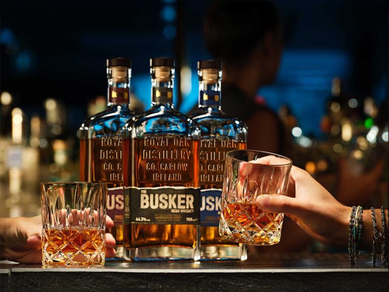 A glamor photo of three bottles of Busker.