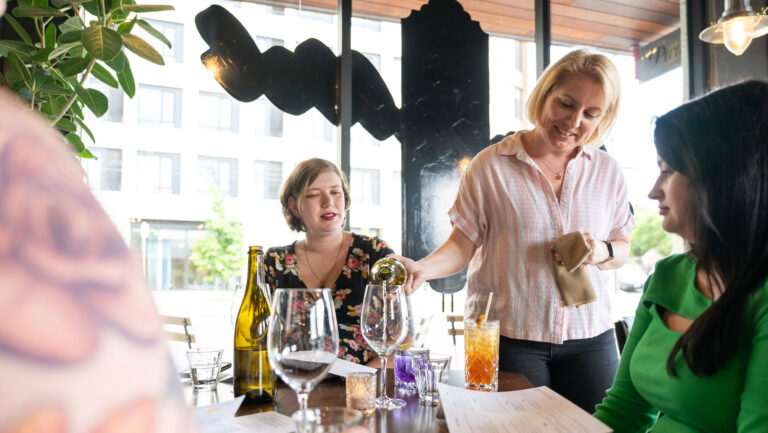 Stacey Gibson pours wine for guests at Parallel in Portland, Oregon.