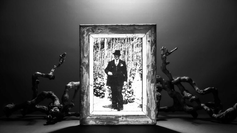 A framed photograph of Giulio Ferrari, the founder of Ferrari Trento. 