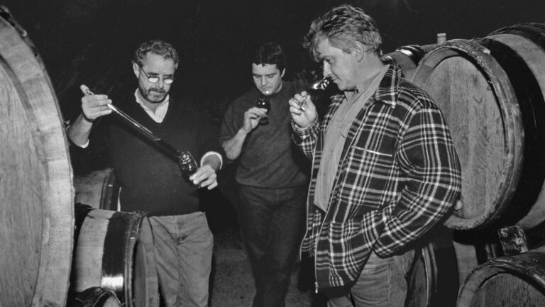 From left to right: Gang of Four members Marcel Lapierre, Guy Breton, and Jean-Paul Thévenet taste in the cellar. Photo by Gail Skoff.