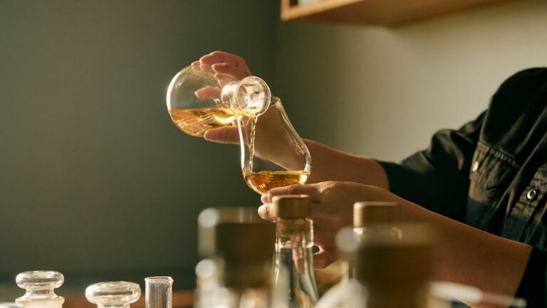 Pouring Japanese whisky at Kanosuke distillery.