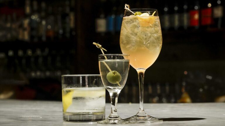 Three tiny cocktails by bar loon.